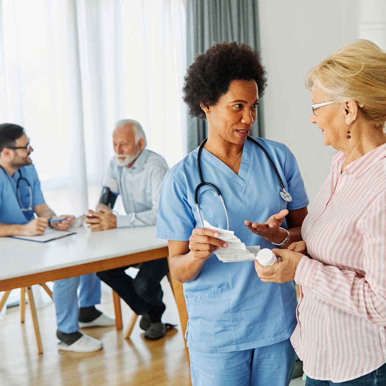 Hosice nurses work with a husband and wife